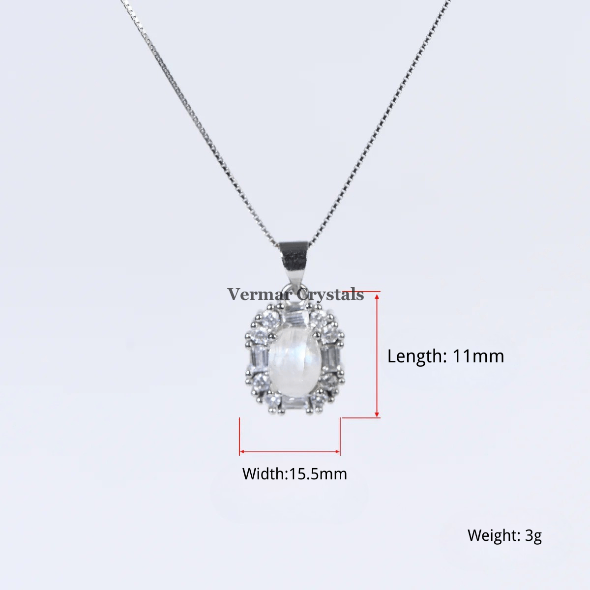 Delicate silver pendant featuring an 11mm blue moonstone halo surrounded by small clear stones on chain