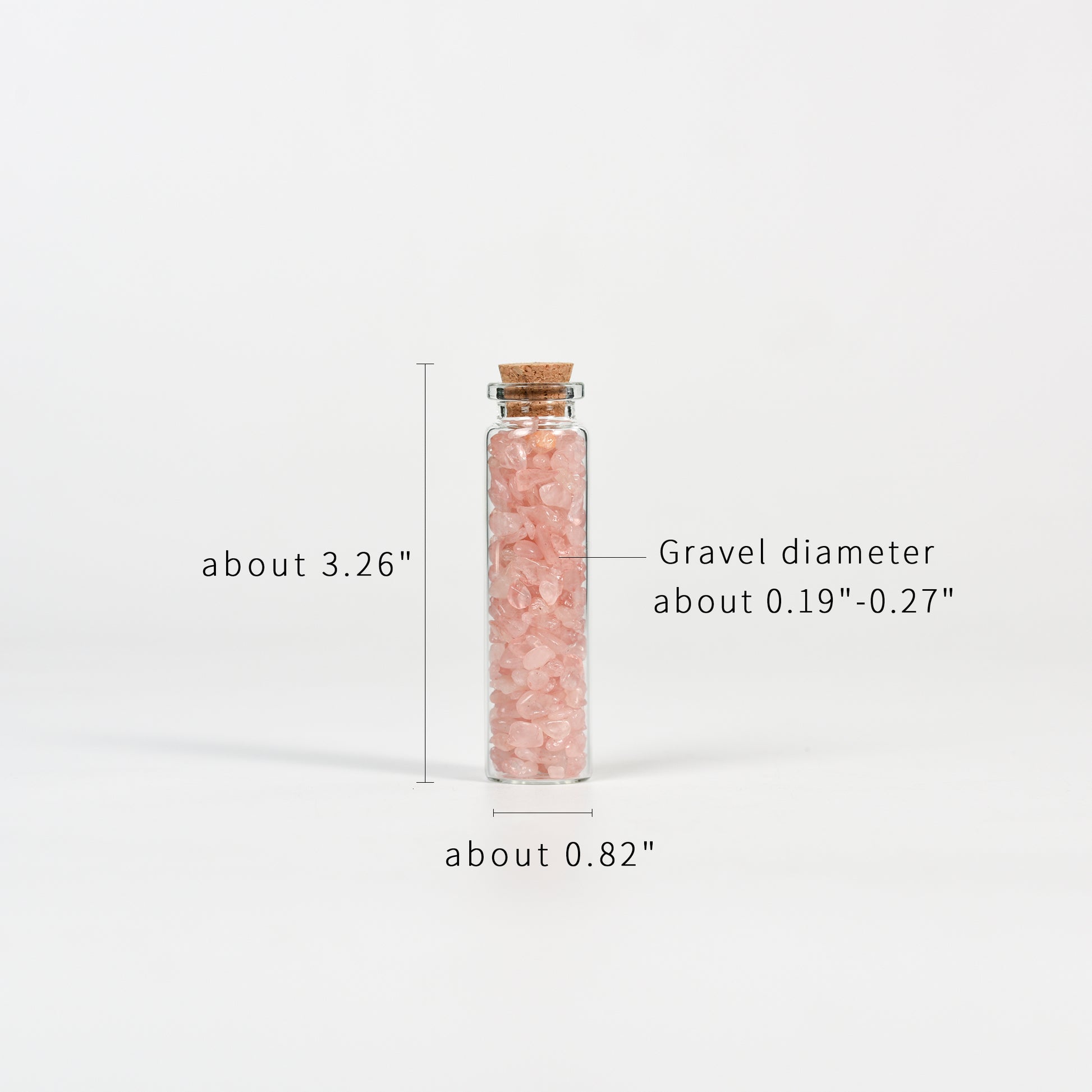 Glass vial filled with small pink crystal chips sealed with natural cork on white background with measurements