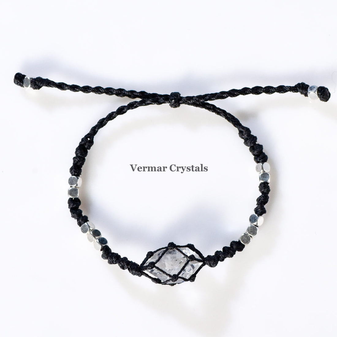 Handcrafted Herkimer Diamond crystal bracelets with durable braided cord and silver bead accents on white background