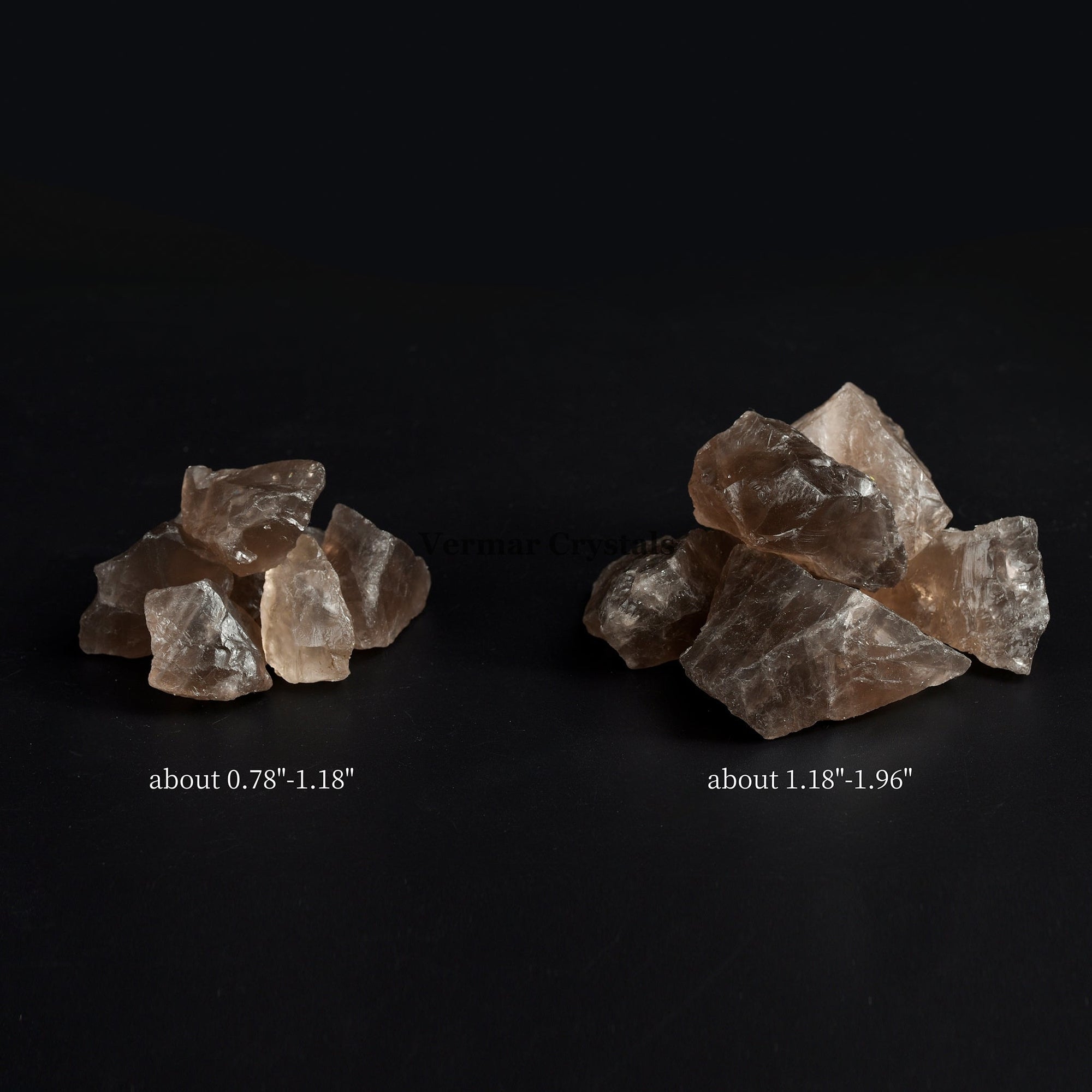 Natural smoky quartz crystal stones in two size groups on a black background with size measurements shown