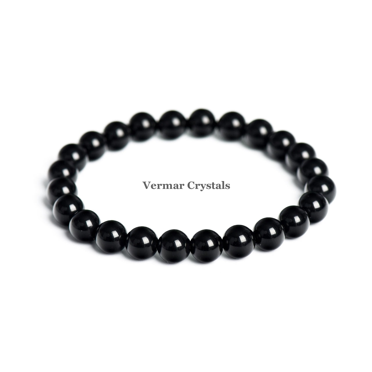 Stretchy bracelet made of polished 8mm black obsidian round beads arranged in a circle on a white background