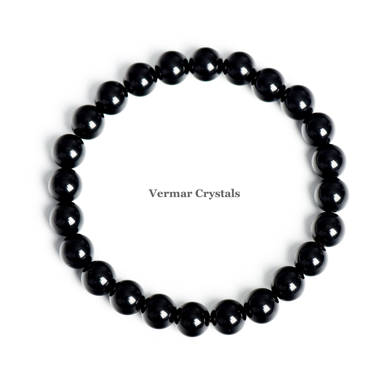 Stretchy bracelet made of polished round black obsidian crystal beads arranged in a circle on white background