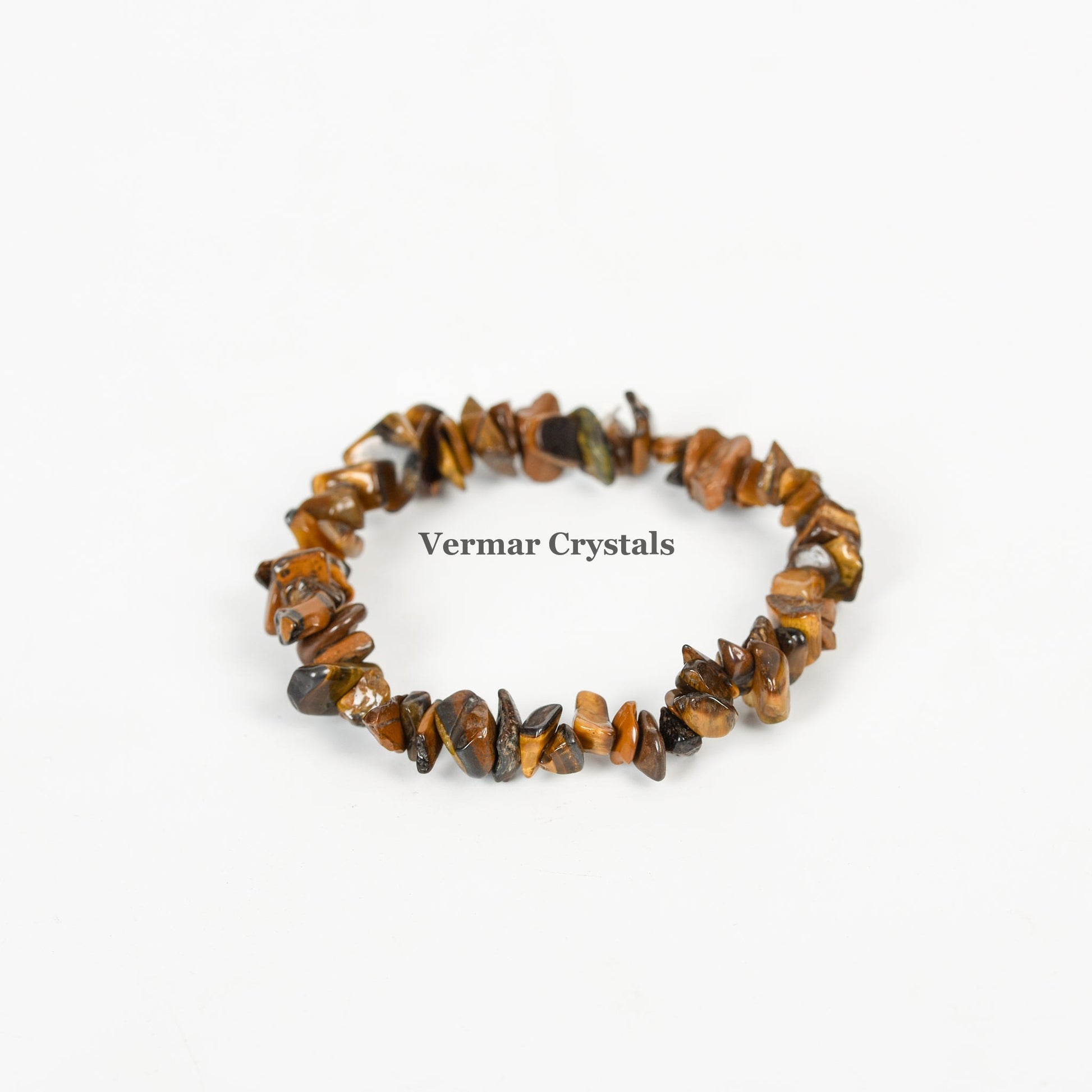 Handmade stretchy bracelet made of irregular polished brown and golden Tiger's Eye stone chips on white background