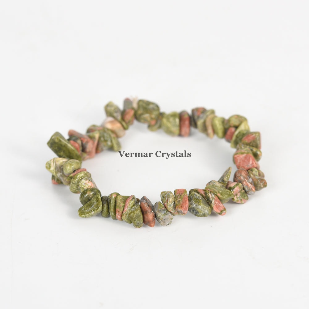 Handmade stretch bracelet made of irregular green and pink Unakite Jasper chip stones on white background