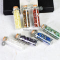 Chakra Healing Chip Stone Wishing Bottle Set with seven glass bottles filled with colorful chakra stones and silver charms
