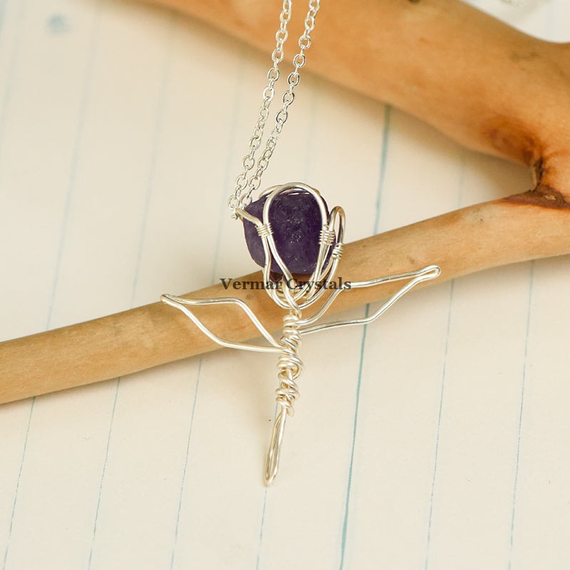 Handcrafted amethyst rose pendant wire wrapped with silver on a delicate silver chain necklace against black background