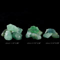 Three groups of rough green fluorite crystal stones of varying sizes on a black background with size labels