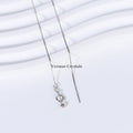 Delicate silver chain necklace with spring clasp and fine bar on white textured background