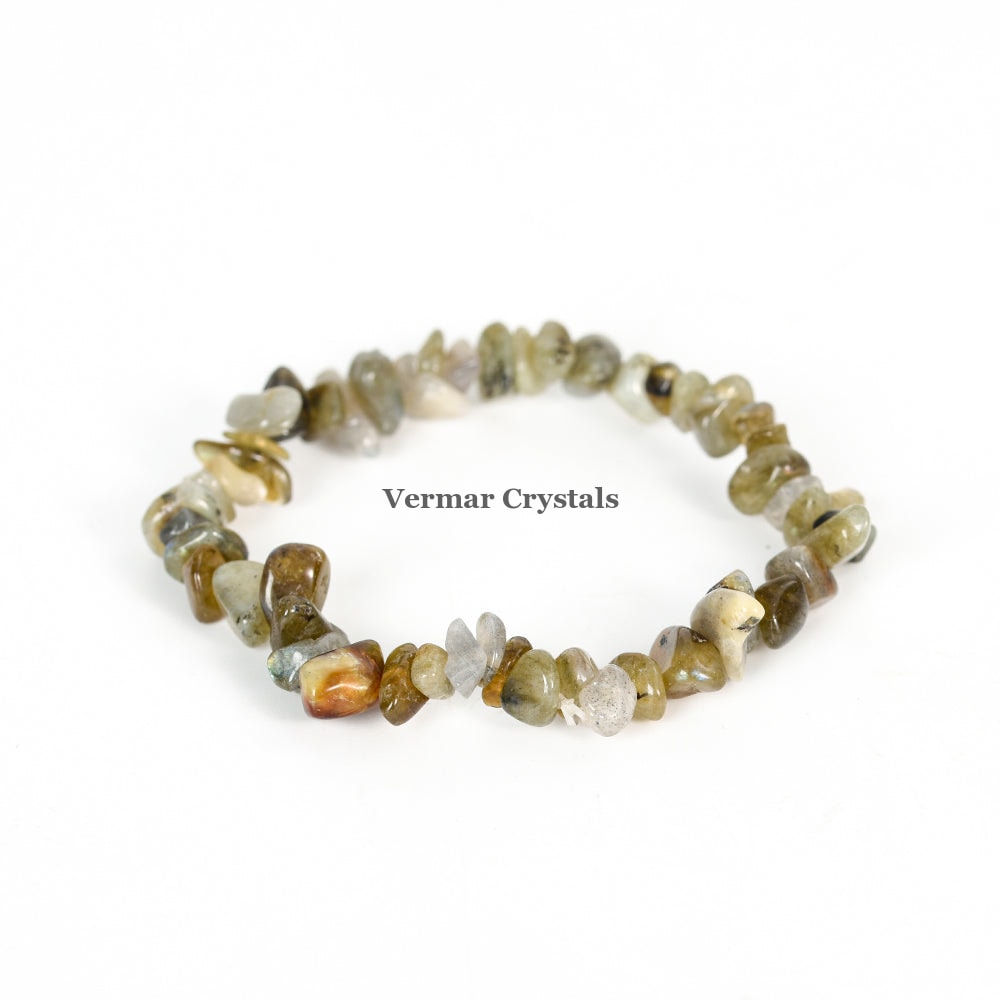 Handmade stretchy bracelet made of irregular labradorite chip stones in various shades on a white background