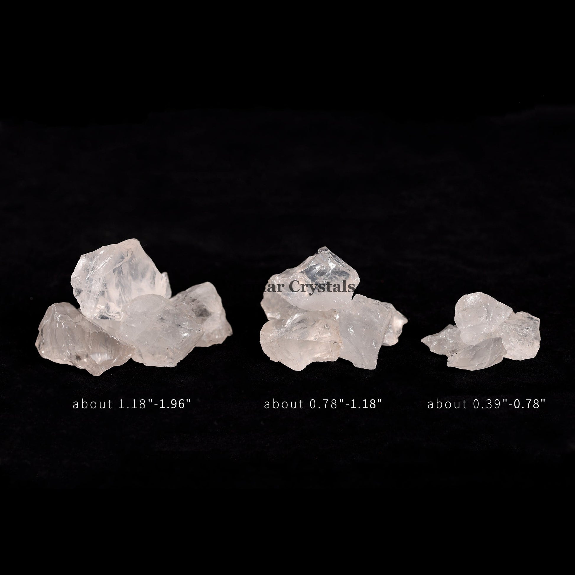 Three naturally formed clear quartz stones in varying sizes displayed against a black background with size measurements.
