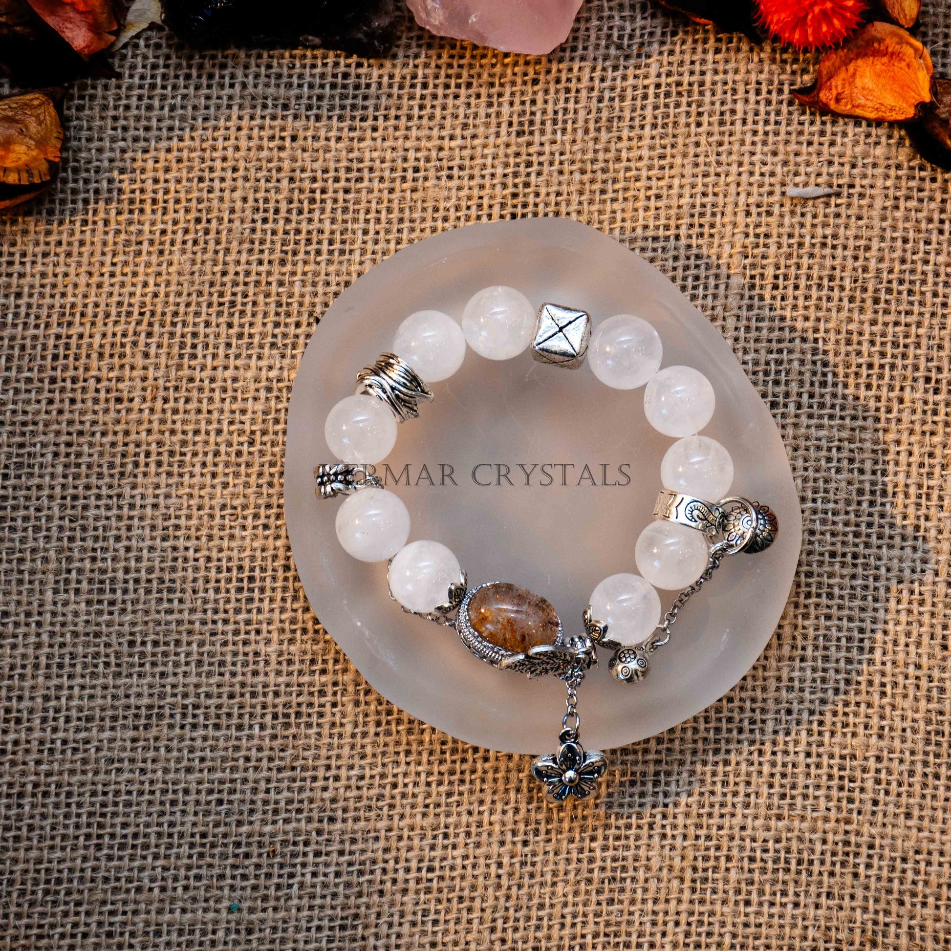 White and garden phantom quartz bracelet with silver charms and a central magic box crystal on round stone plate