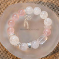 Rose Quartz and White Phantom Quartz beaded bracelet with silver spacer charms on round frosted dish