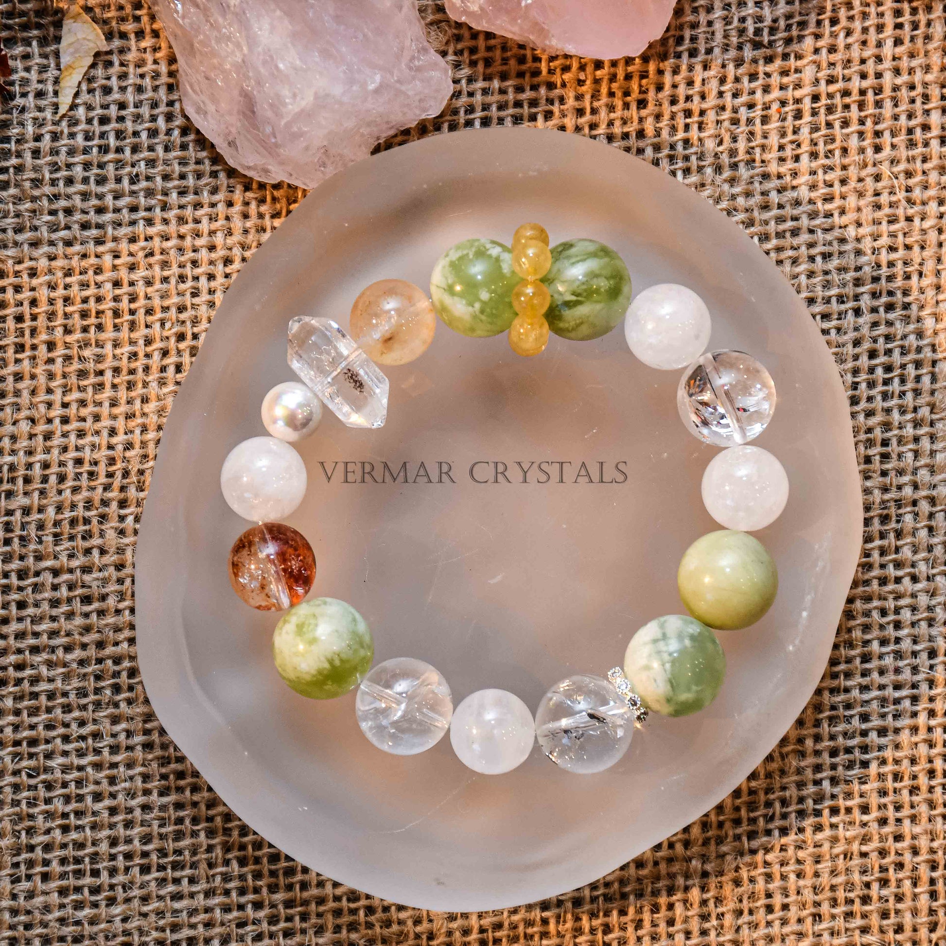 Fresh green and cream white Serpentine Jade bead bracelet with clear and amber stones on frosted round dish