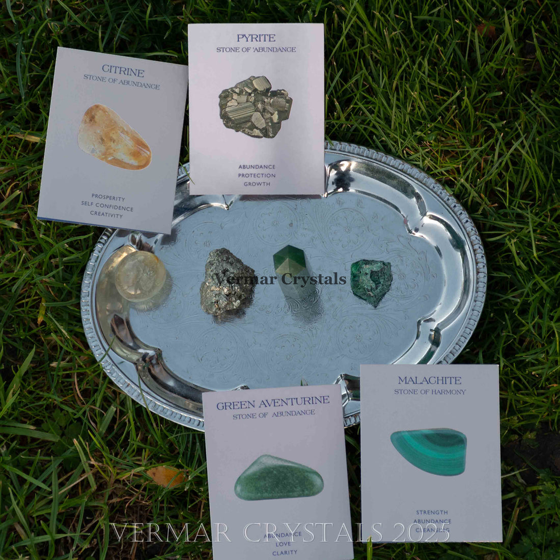 Wealth and Abundance crystal set with pyrite, malachite, green aventurine, and citrine stones on white cards
