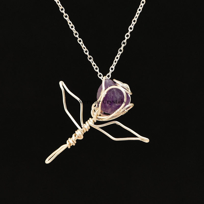 Handcrafted amethyst rose pendant wire wrapped with silver on a delicate silver chain necklace against black background