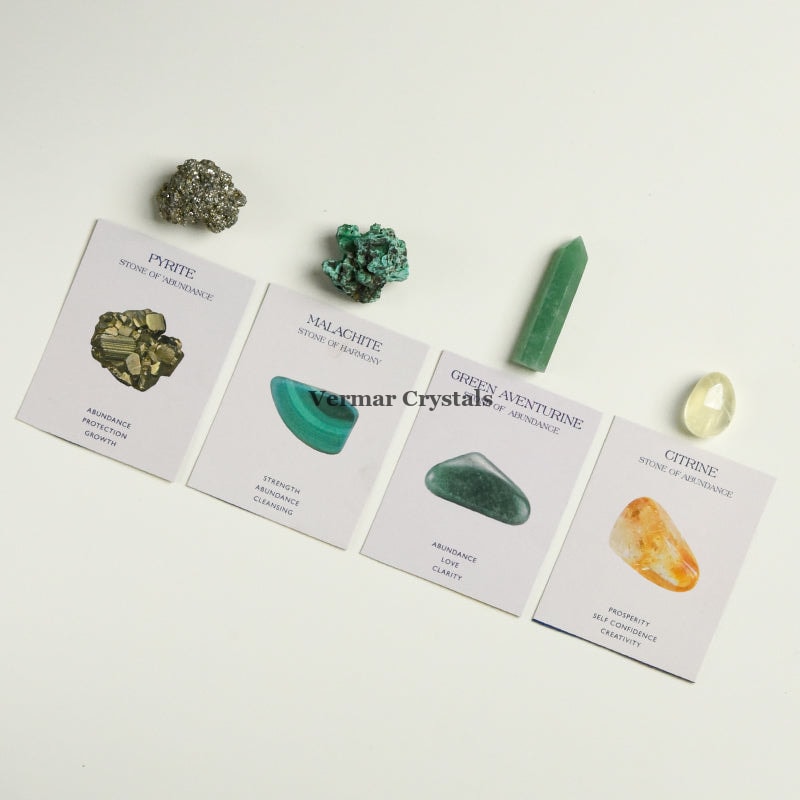 Wealth and Abundance crystal set with pyrite, malachite, green aventurine, and citrine stones on white cards