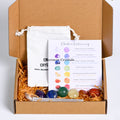 Seven Chakra Healing Crystal Set with tumbled stones, chakra guide card, and white drawstring pouch in eco-friendly box