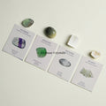 Balance & Harmony crystal set with fluorite, prehnite, selenite, and quartz stones on descriptive cards against light background