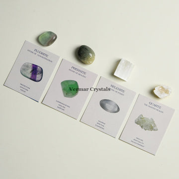 Balance & Harmony crystal set with fluorite, prehnite, selenite, and quartz stones on descriptive cards against light background