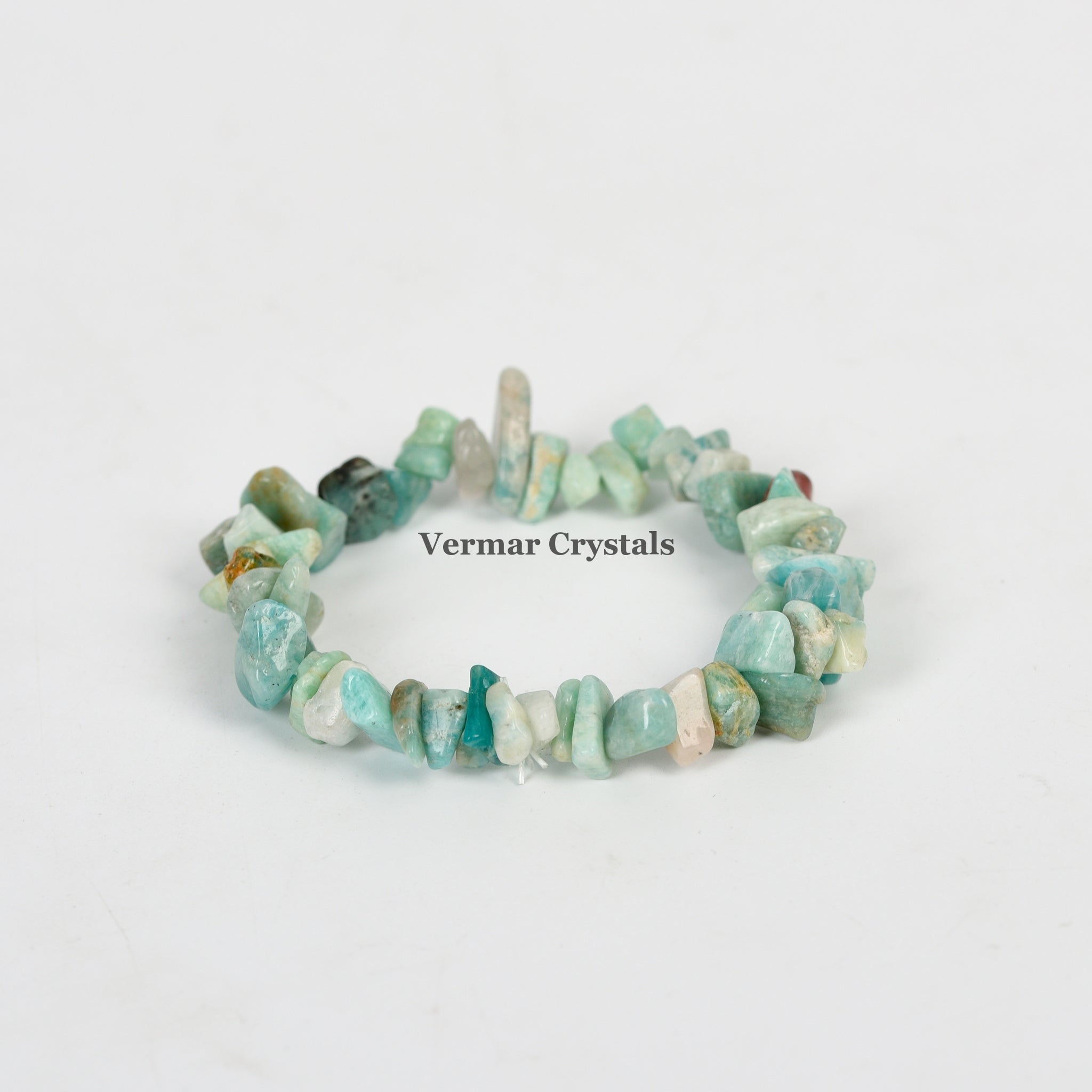 Handmade stretchy bracelet made of irregular light blue and green amazonite chip stones on a white background